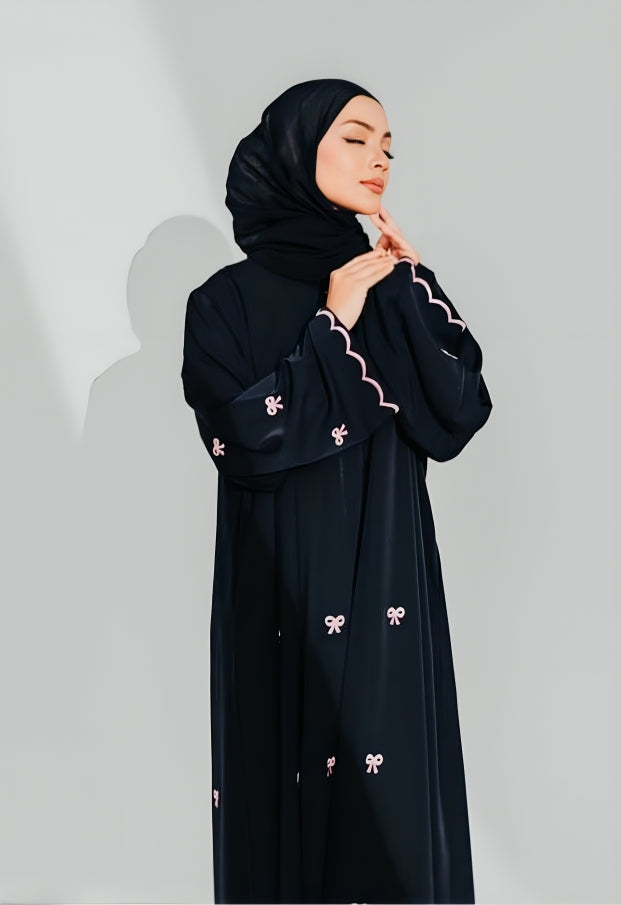 Side view of modest wear abaya showing embroidered details and flowing silhouette perfect for Muslim women's fashion
