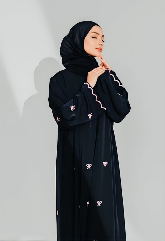 Side view of modest wear abaya showing embroidered details and flowing silhouette perfect for Muslim women's fashion