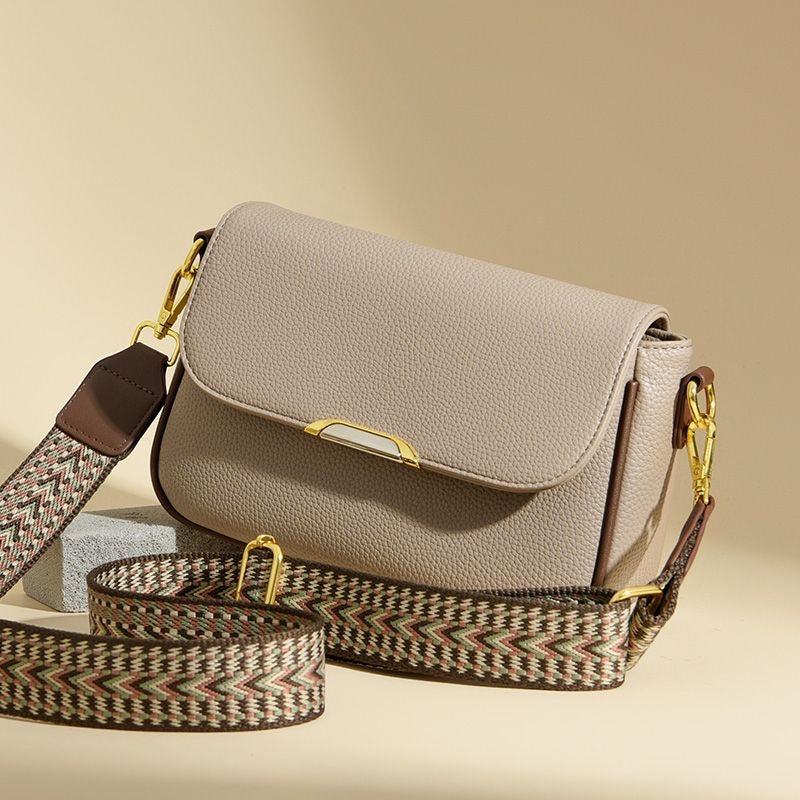 Elegant luxury ladies handbag in beige with gold chain strap showing premium crossbody bag design for everyday and party wear