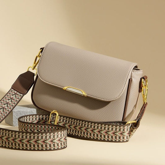 Elegant luxury ladies handbag in beige with gold chain strap showing premium crossbody bag design for everyday and party wear