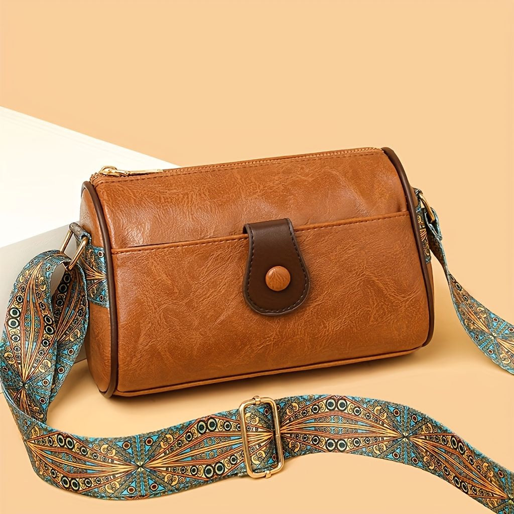 Close-up of brown luxury handbag with chain strap highlighting premium material and elegant design details for women's accessories