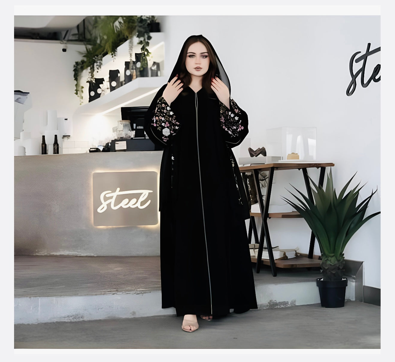 Side view of elegant floral embroidered abaya showing graceful silhouette and premium fabric drape for modest fashion