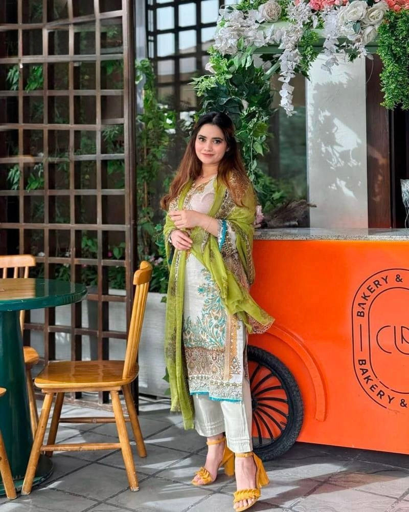 Detailed embroidered neckline and daman border on cream pure cotton Pakistani suit fabric with semi lawn buttons